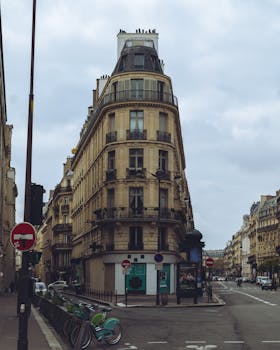 Scenic view of iconic Paris street showcasing classic architecture under an overcast sky.