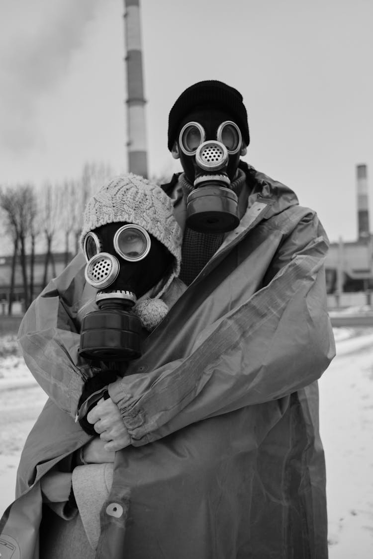 A Couple Wearing Gas Masks