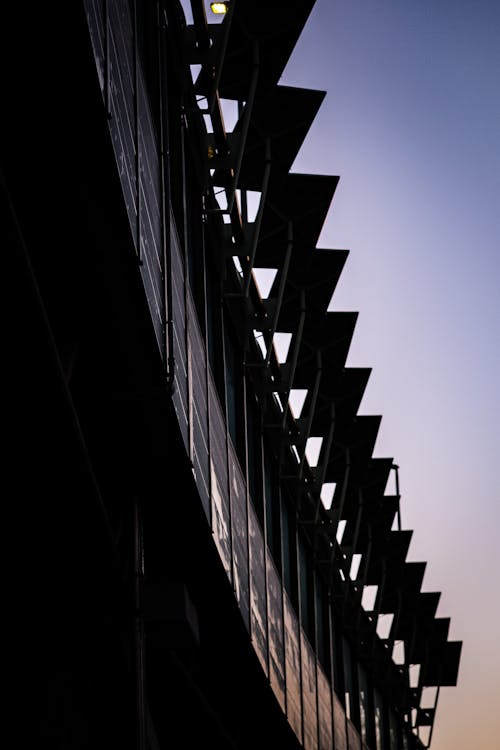Silhouetted Modern Building Exterior at Sunset 