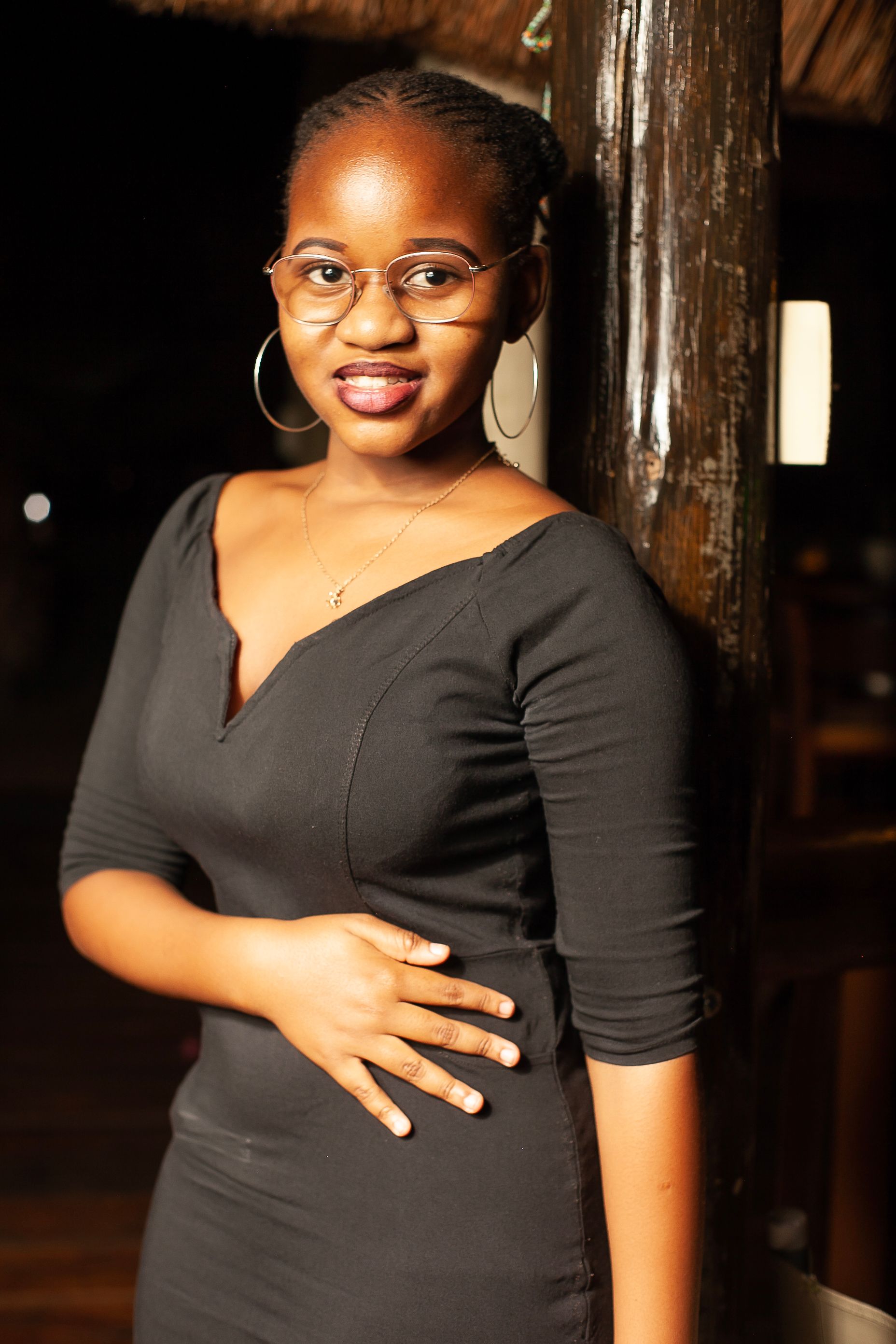 Young Elegant Woman in a Black Dress · Free Stock Photo