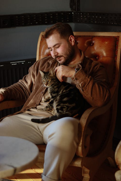 Man Sitting on an Armchair