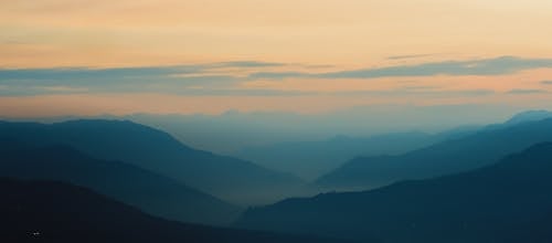 Silhouette of Mountains during Sunset