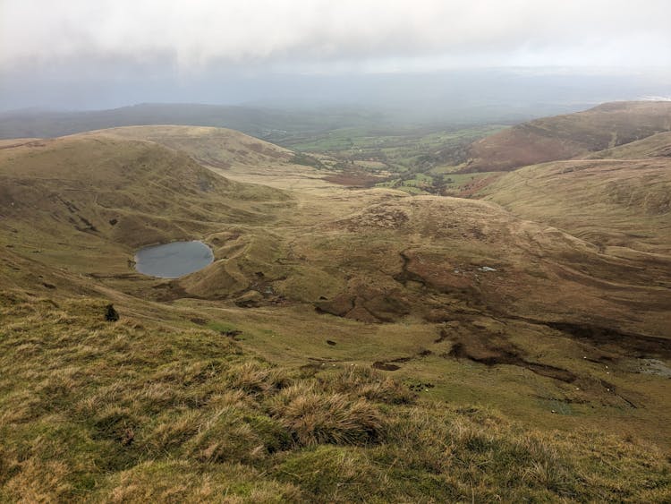 Hills Under Cloudy Sky