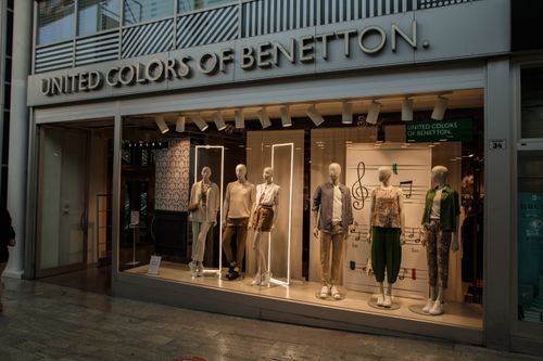 Free Fashionable storefront of United Colors of Benetton with mannequins in modern attire, Casalecchio di Reno. Stock Photo