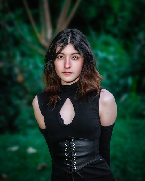 A Woman in Black Top Looking with a Serious Face