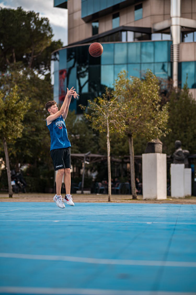 Young Man Playing Basketball 