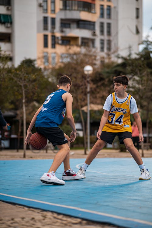 Young Men Playing Basketball 