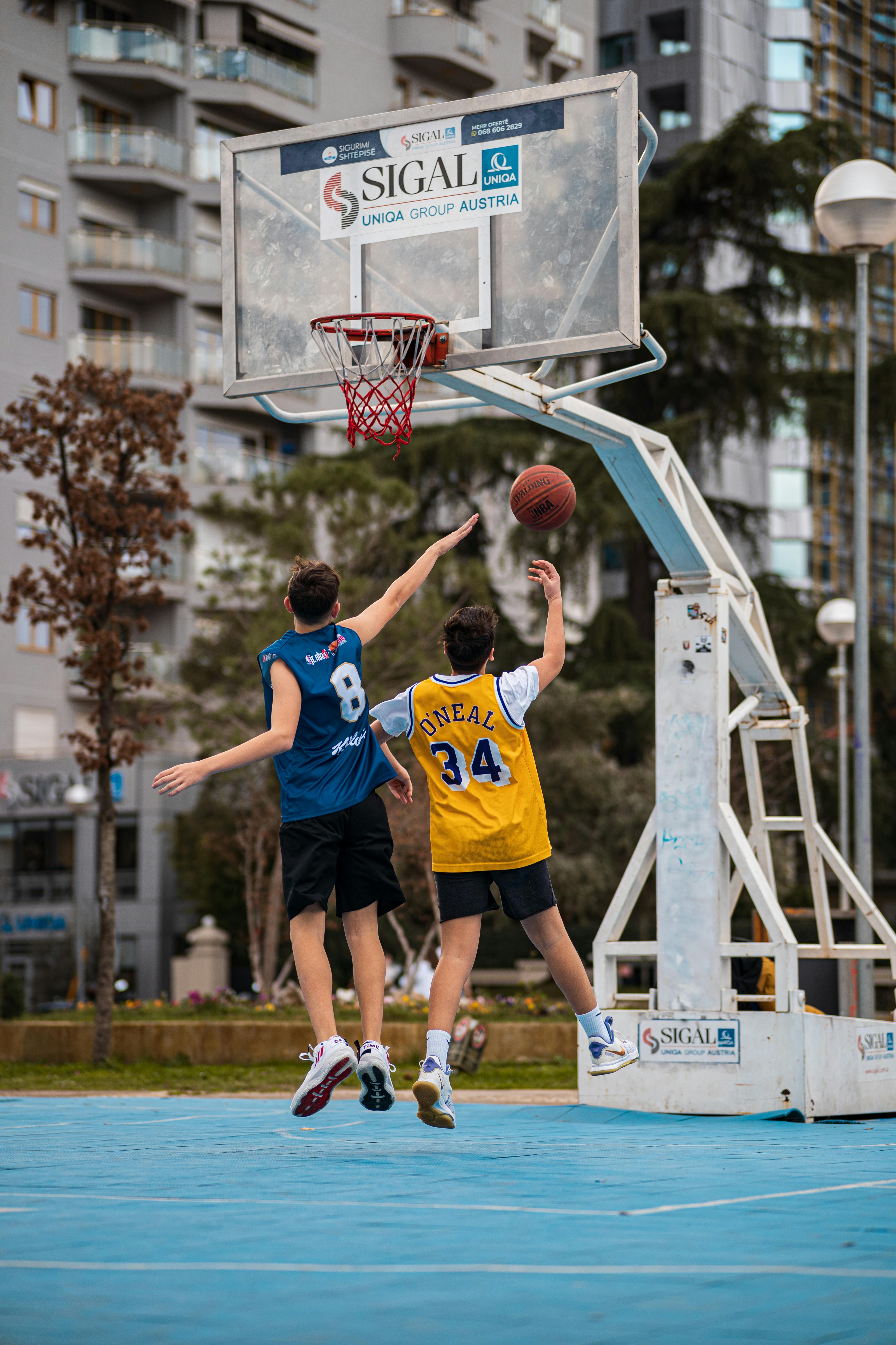 young men playing basketball