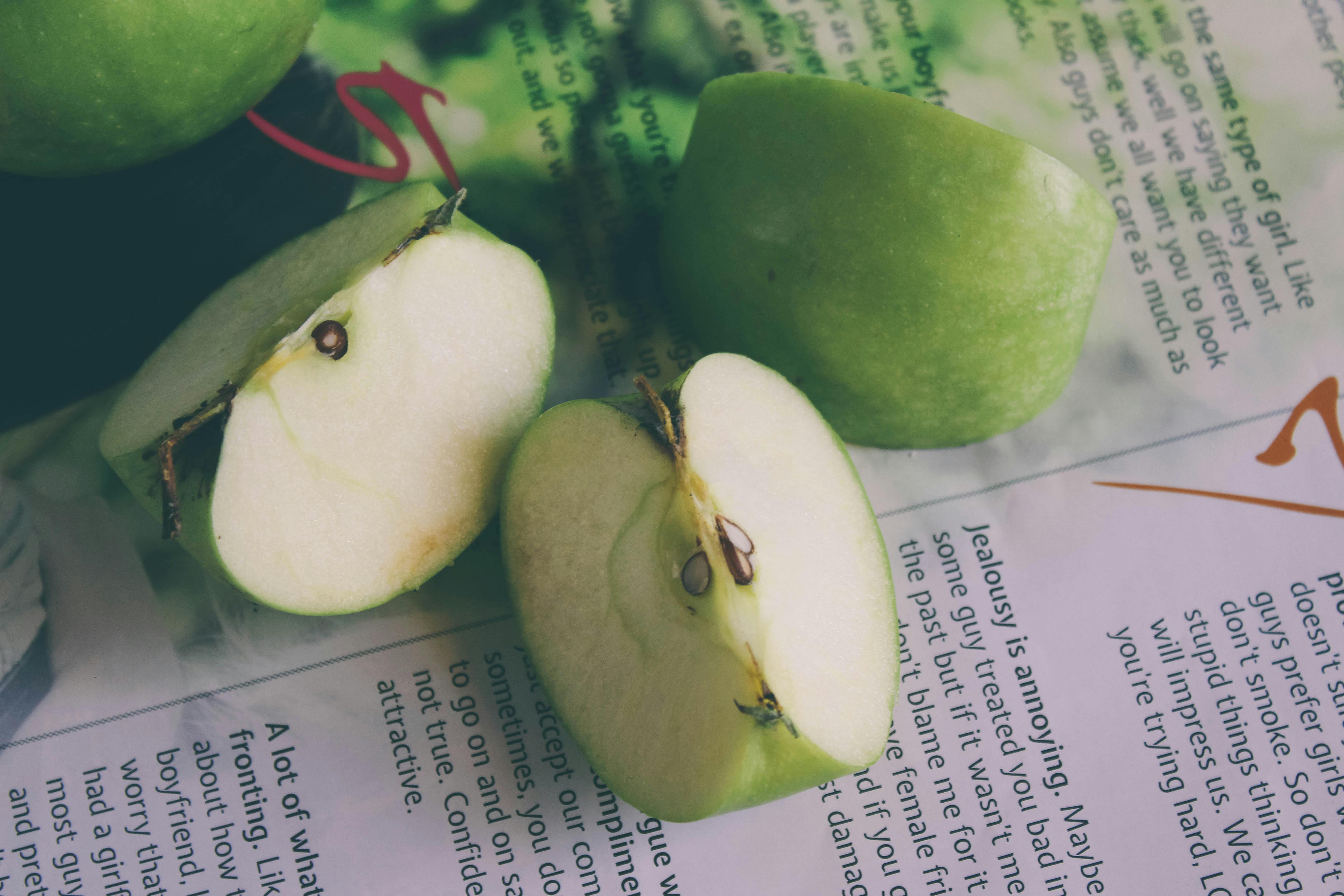 Free stock photo of green apples half cut