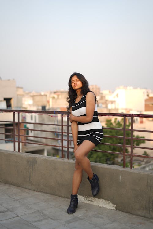 Photo of Woman wearing Black and White Dress