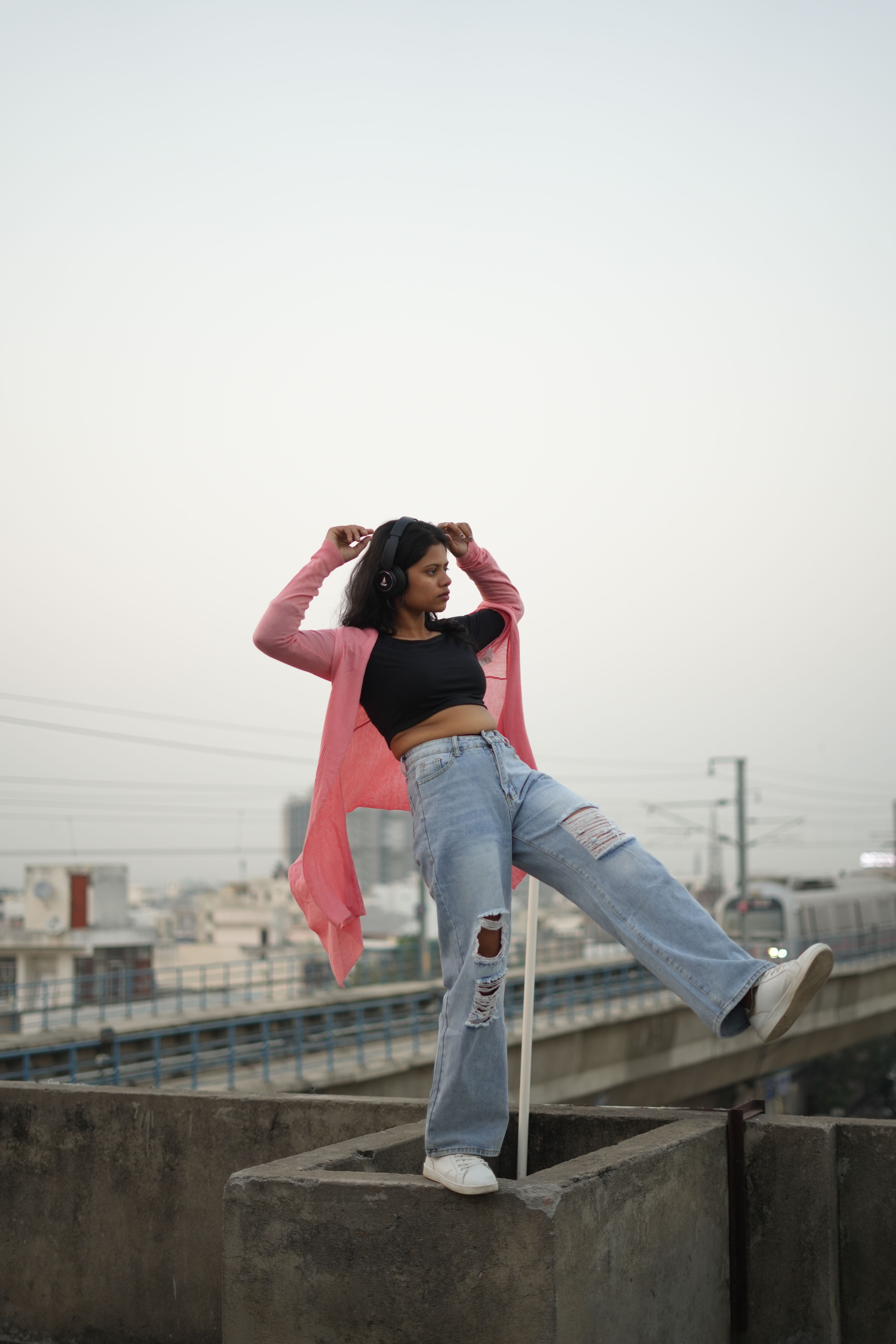 Woman Balancing on a Rooftop · Free Stock Photo