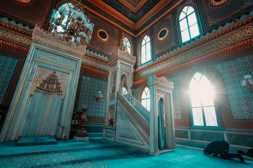 Free Sunlit interior of Yıldız Hamidiye Mosque with detailed Islamic architecture and prayer area. Stock Photo
