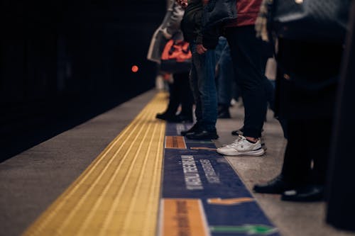 People on a Subway Platform Waiting for a Train