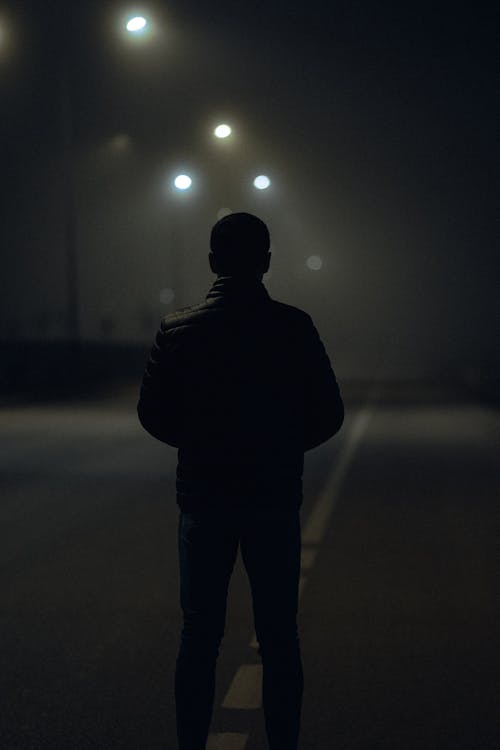 Alone Man on Street at Night