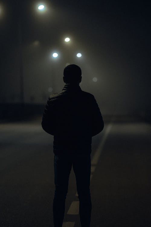 Free Alone Man on Street at Night Stock Photo