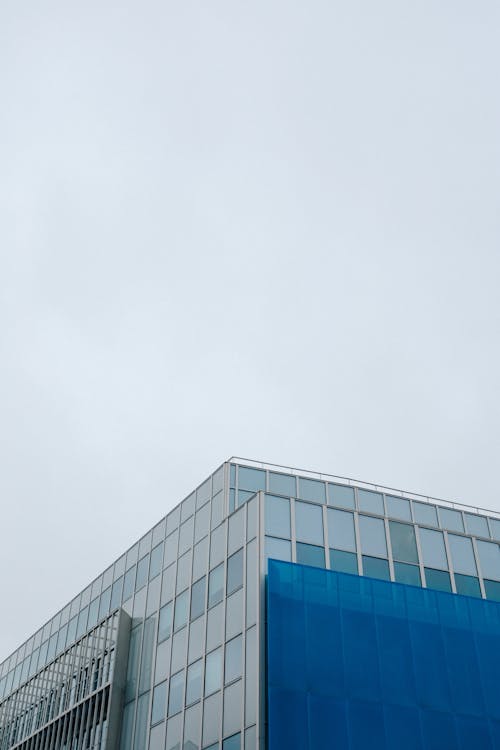 Modern Glass Building against Blue Sky
