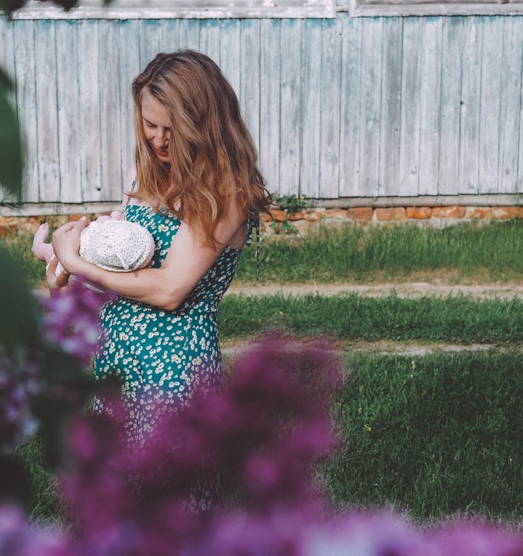 Mother With Baby In Garden