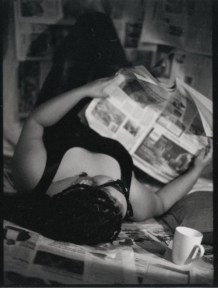 Woman Reading A Newspaper