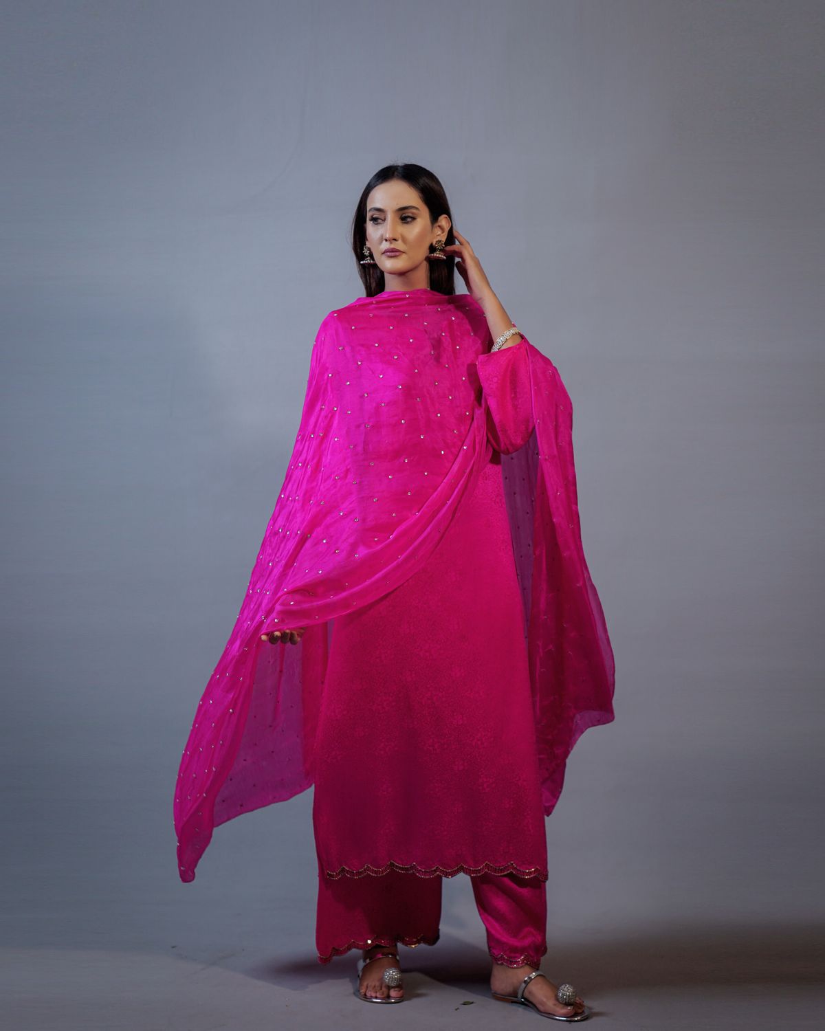 Woman in a pink kurta and dupatta