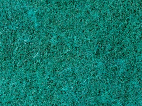 Close-up view of an emerald green textured surface, ideal for background use.