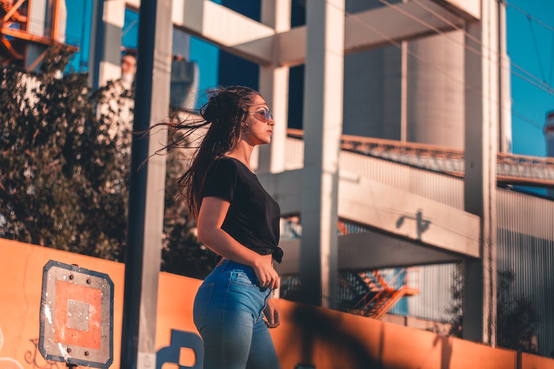 Free Woman Standing on Sidewalk Stock Photo