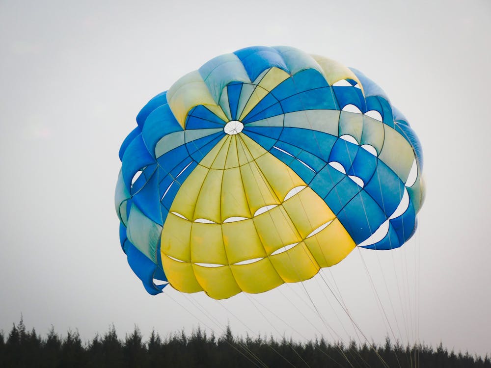 A person is parasailing in the air