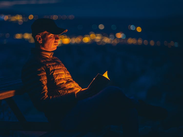 Man Reading At Night