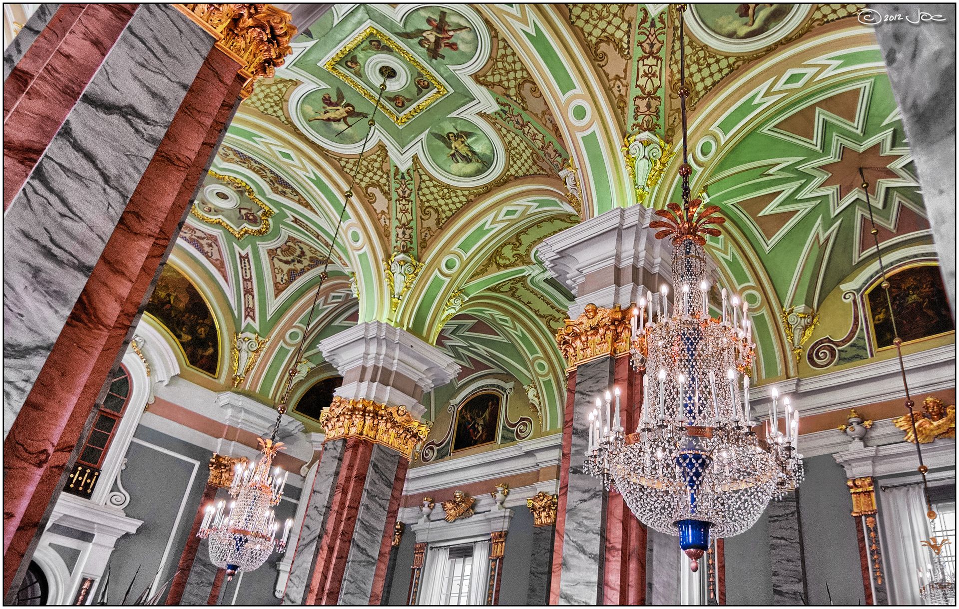 Luxurious Baroque architecture with ornate chandeliers in a historic Russian building.