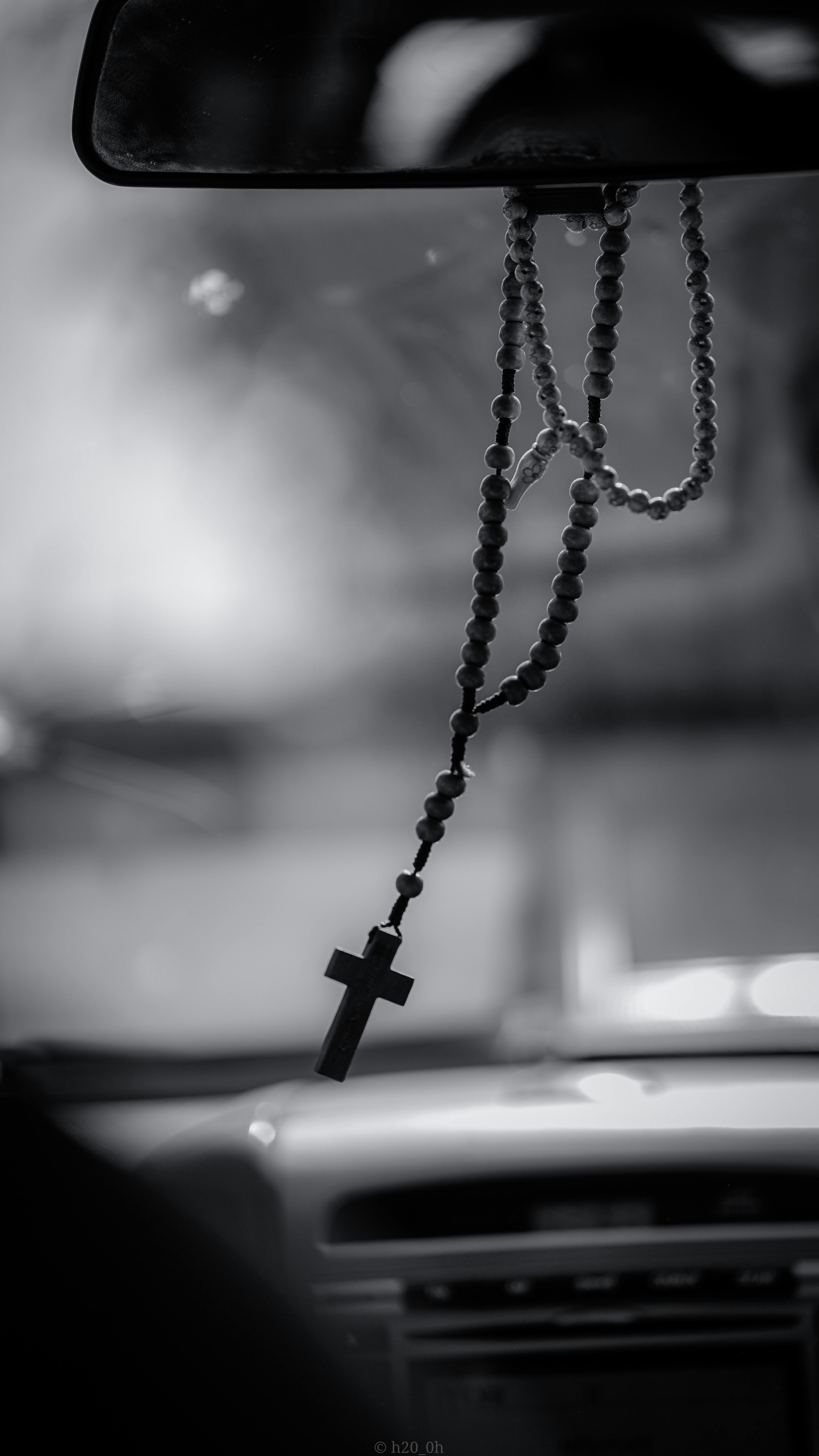 A Grayscale of a Rosary Hanging on a Rear View Mirror · Free Stock Photo