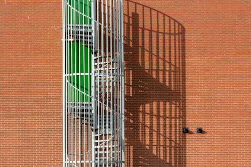 Spiral Staircase at Brick Wall