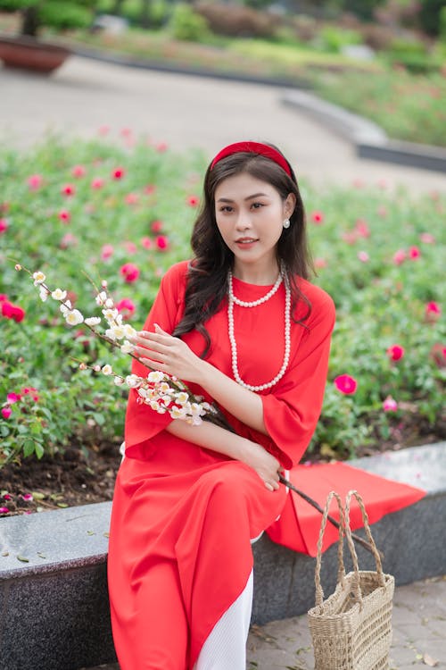 Woman Wearing a Red Ao Dai