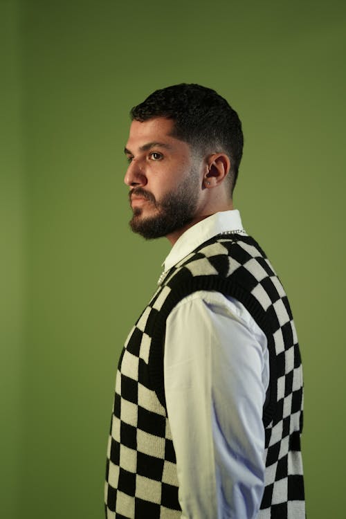A Man in Black and White Checkered Vest