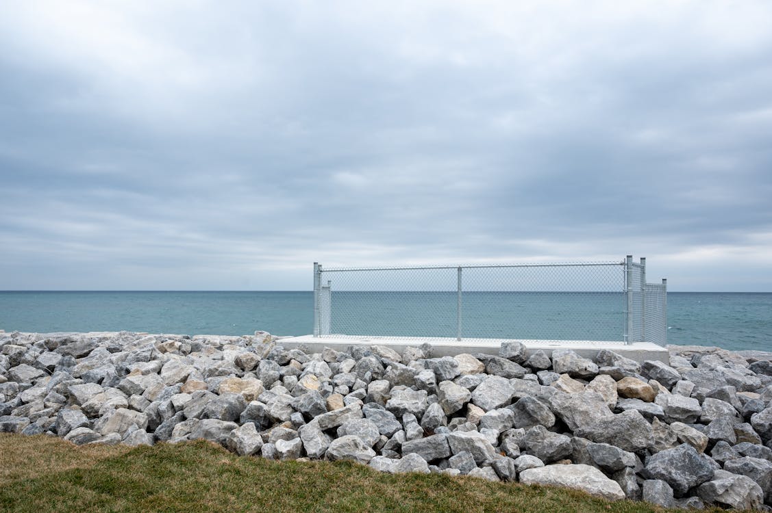 Chain Link Fence On Concrete Dock Free Stock Photo chain-link-fence-on-concrete-dock-free-stock-photo