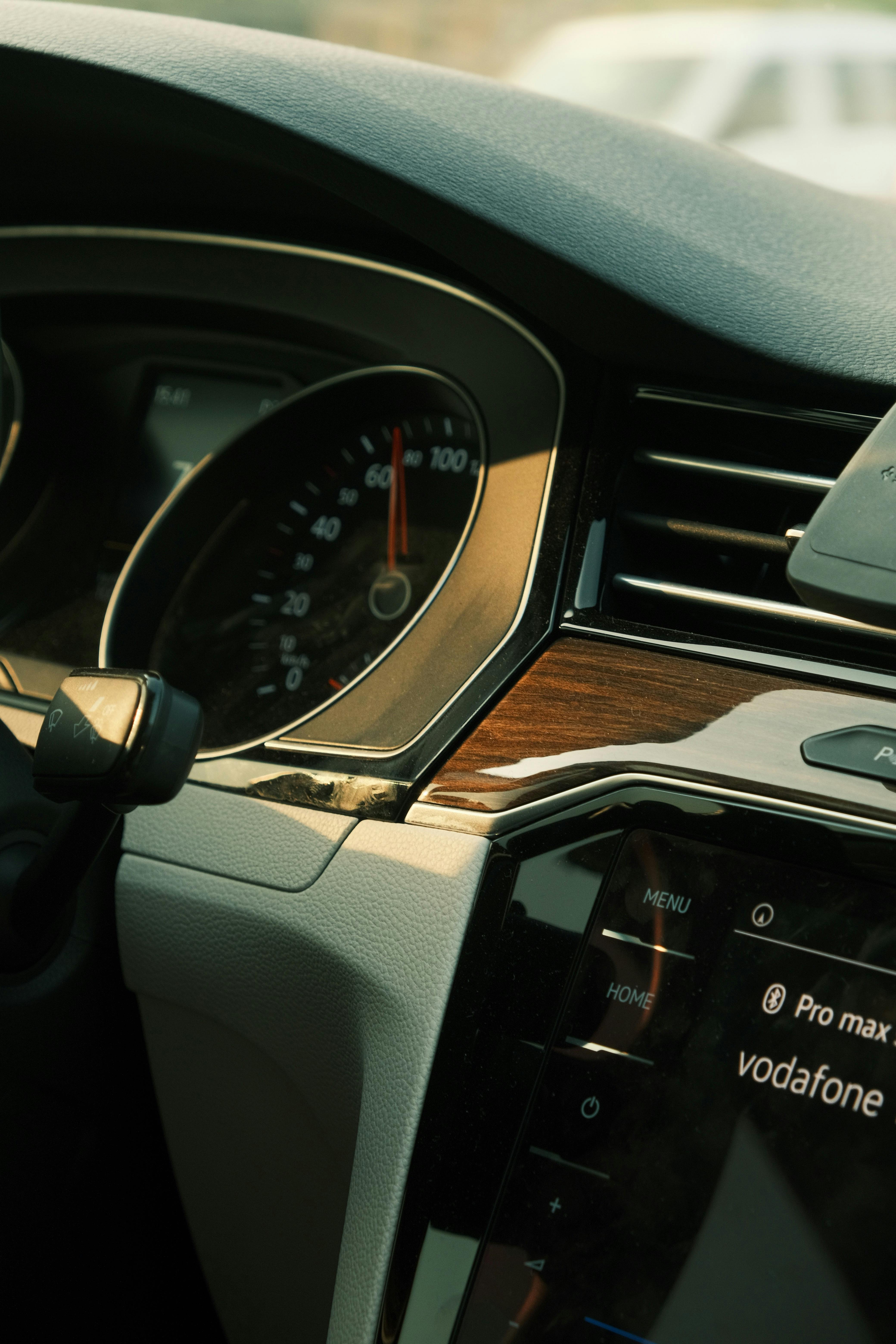 Close-up view of a luxury car interior featuring speedometer and dashboard details.