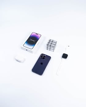 Modern Apple gadgets arranged on a white background for a sleek, minimalist look.