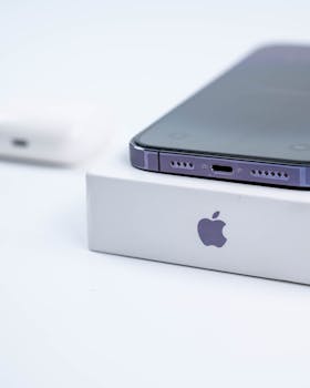 Detailed image of an advanced smartphone on a white branded box, showcasing sleek design.