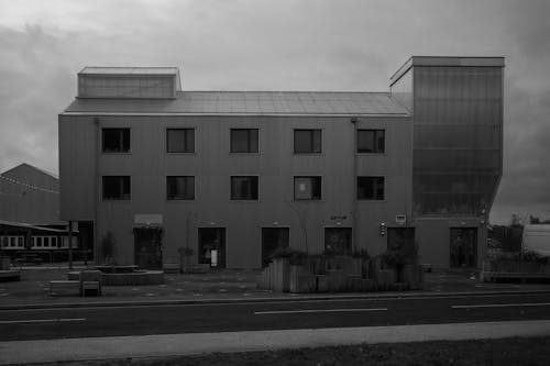 A Concrete Building Along an Asphalt Road