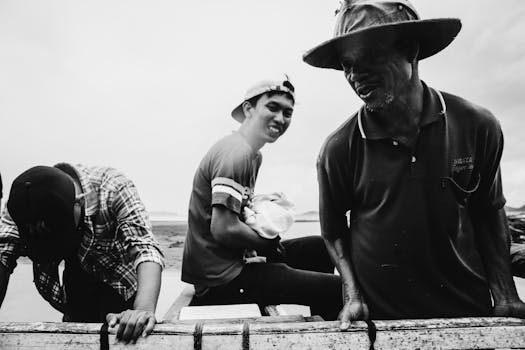 Three friends enjoying a boat ride with smiles and laughter.