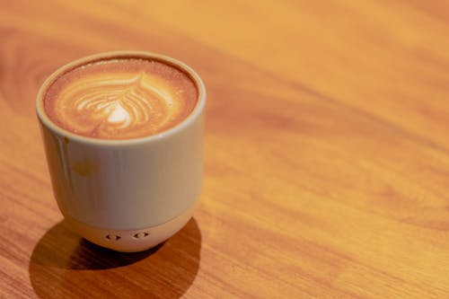Coffee with Milk Served on Wooden Table