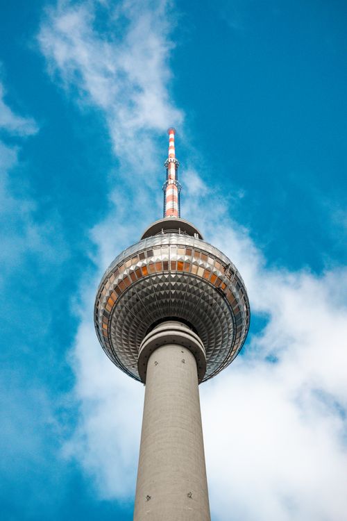 Free Low angle view of the famous Berlin TV Tower on a clear day with a striking blue sky. Stock Photo
