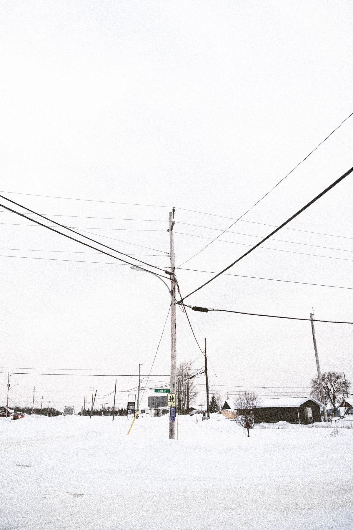Snow-covered power lines and utility pole in extreme cold weather, the conditions EOP-012 cold weather preparedness plans must address