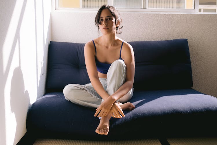 A Woman Sitting On A Sofa