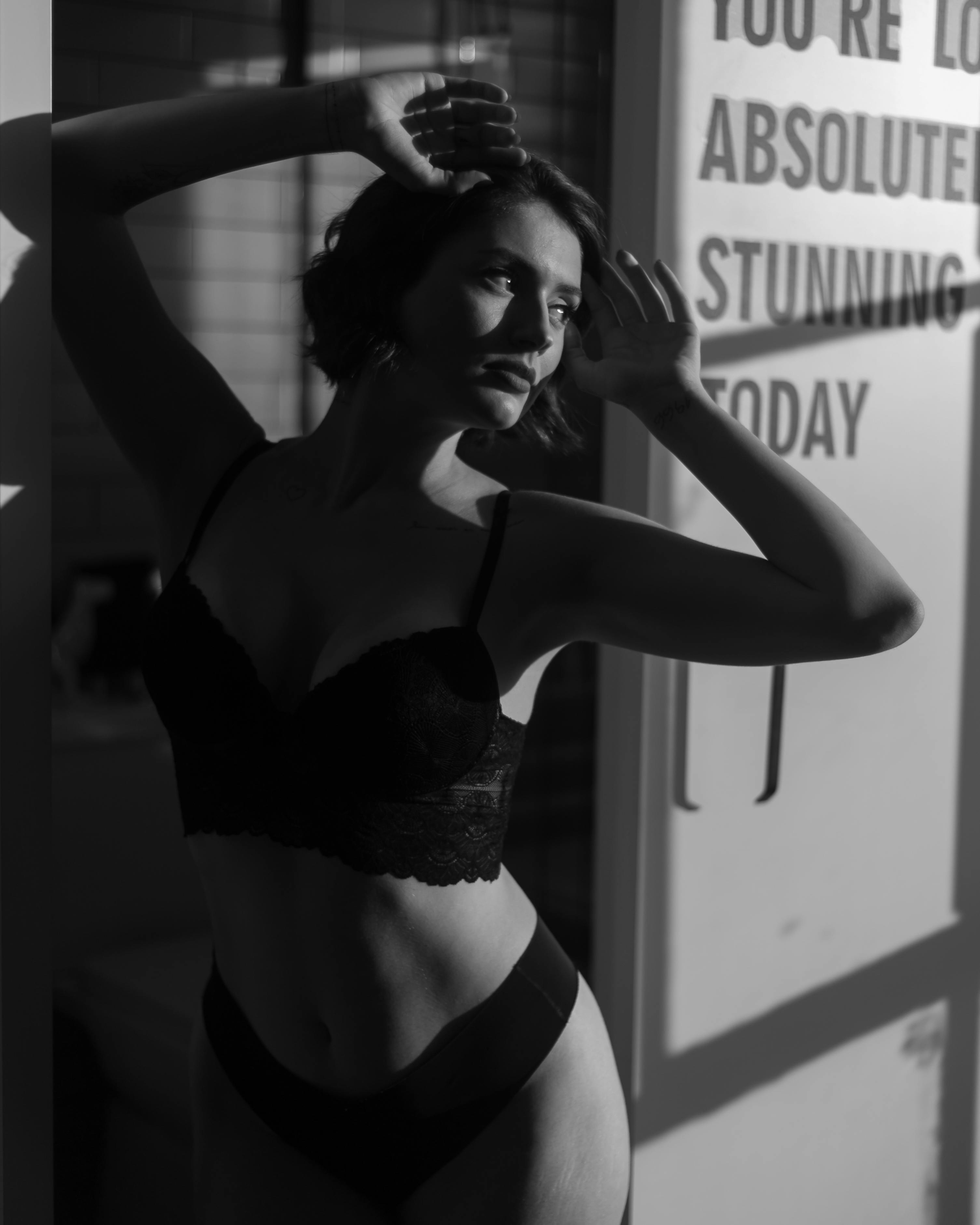 a woman wearing black bikini posing