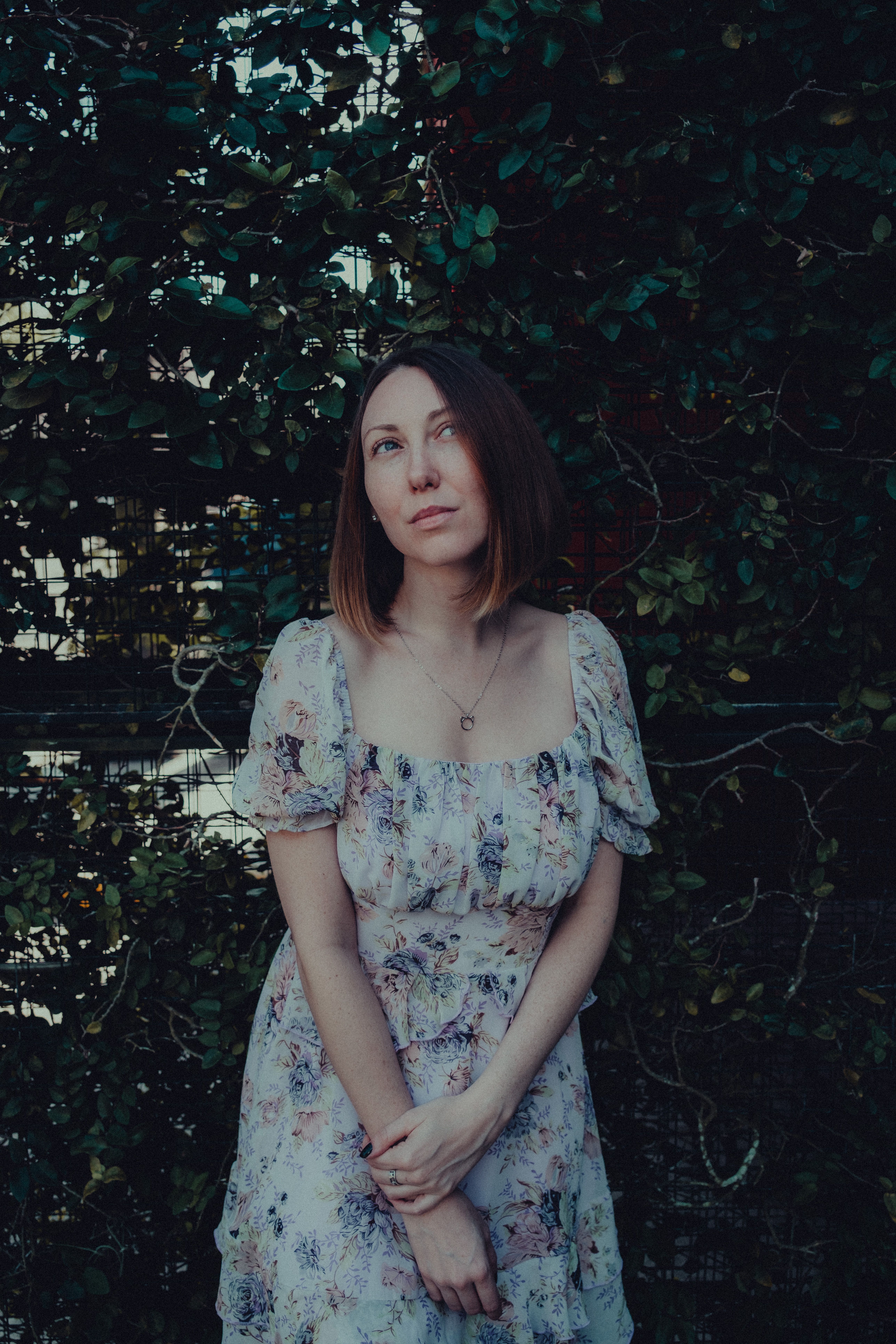 Woman in Floral Dress among Trees · Free Stock Photo