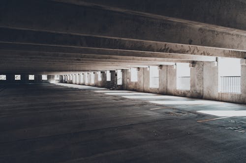 Light Shining into Empty Abandoned Concrete Warehouse