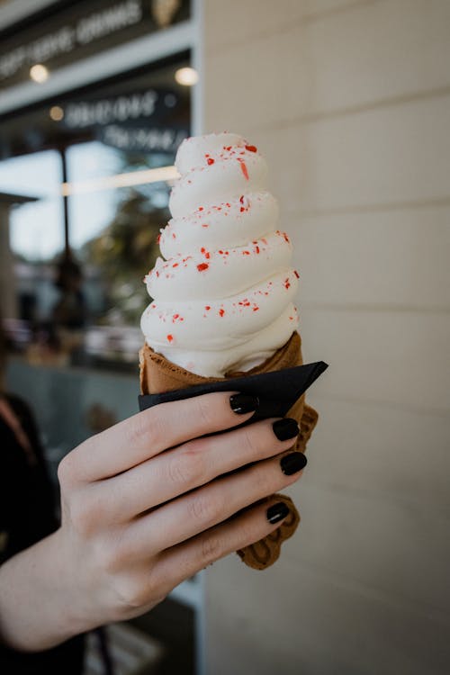 Close-Up Shot of A Person Holding Ice Cream