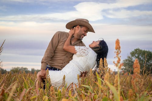 Couple Hugging on a Field in Summer 