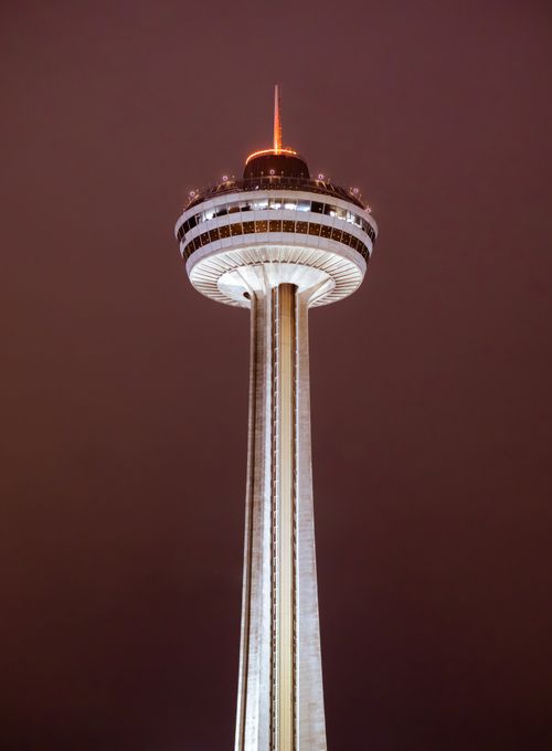 Free Elegant night view of Skylon Tower in Niagara Falls, Canada, a prominent tourist attraction. Stock Photo