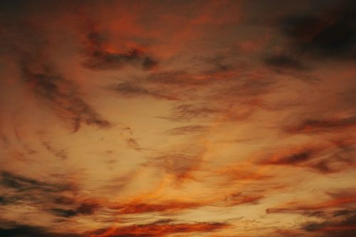 Free Vivid and dramatic sunset sky filled with colorful clouds, creating a picturesque scene. Stock Photo