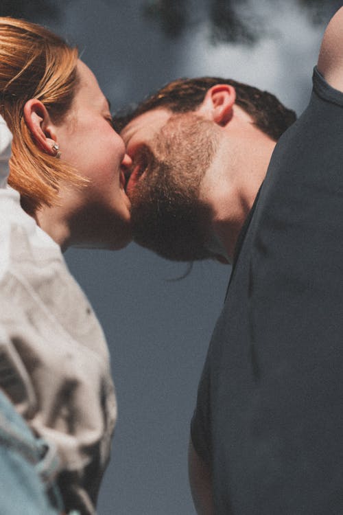 Low Angle Shot of a Kissing Couple